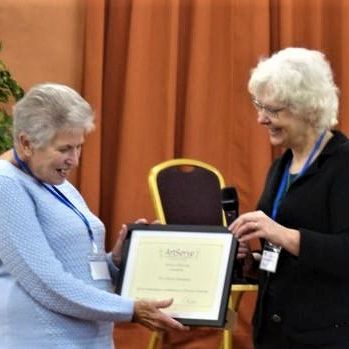 Stella Tidmarsh receives her certificate